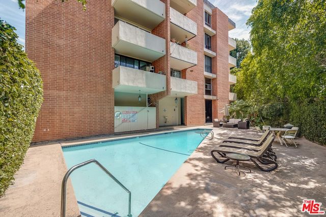 a view of a terrace with sitting area
