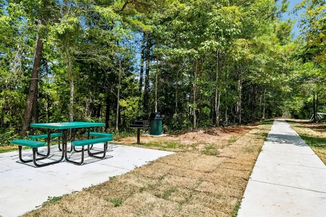 a view of swimming pool with sitting area