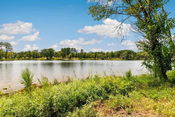 a view of lake with green space
