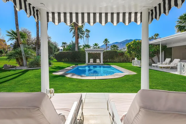 a view of a swimming pool with a garden