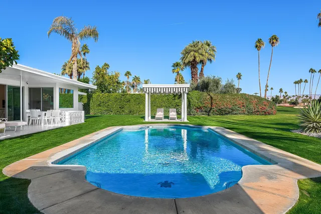 a view of a patio with a yard