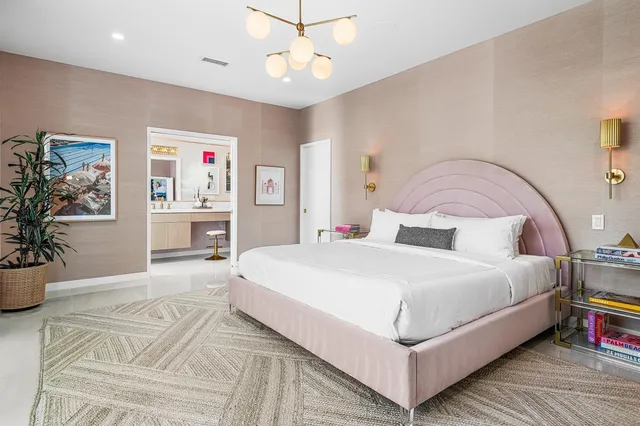 a bed room with a bed window and a television