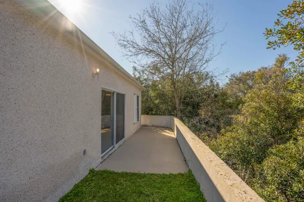 a view of a backyard with pathway