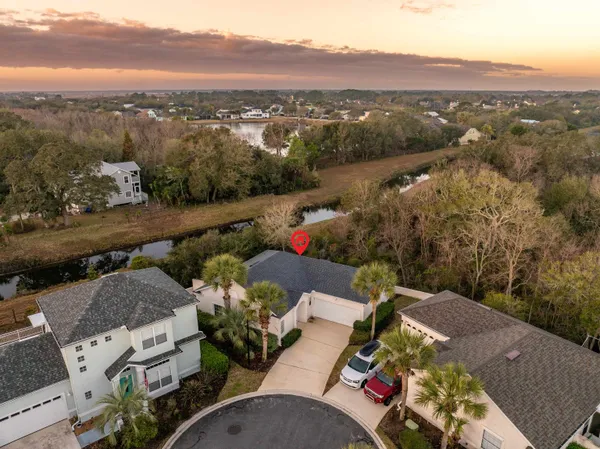 an aerial view of a house with a yard
