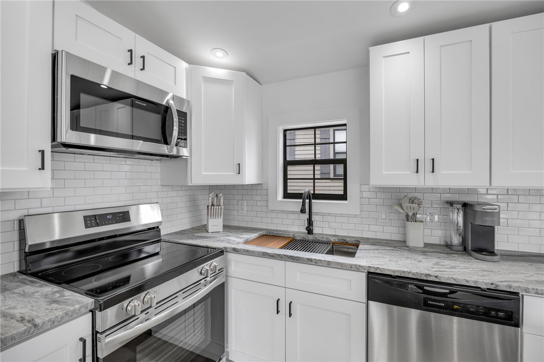 1230 Melton Road, Unit 30 West Union, SC 29696 - Photo 14 of 42 A pristine culinary space showcases sleek stainless steel appliances and ample counter surfaces, ideal for meal preparation.