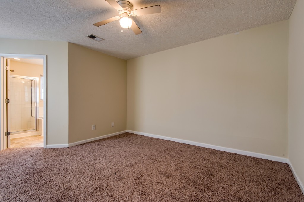 7831 Heaton Way Nashville, TN 37211 - Photo 16 of 35 an empty room with a chandelier fan