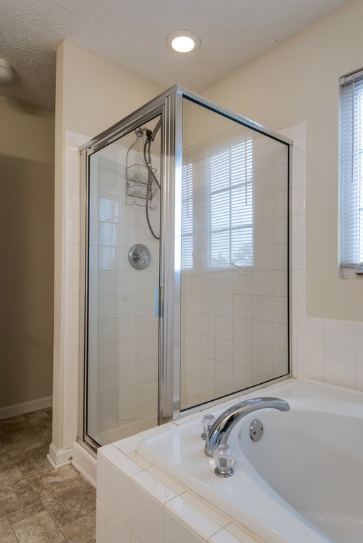 7831 Heaton Way Nashville, TN 37211 - Photo 21 of 35 a bathroom with a tub and a sink