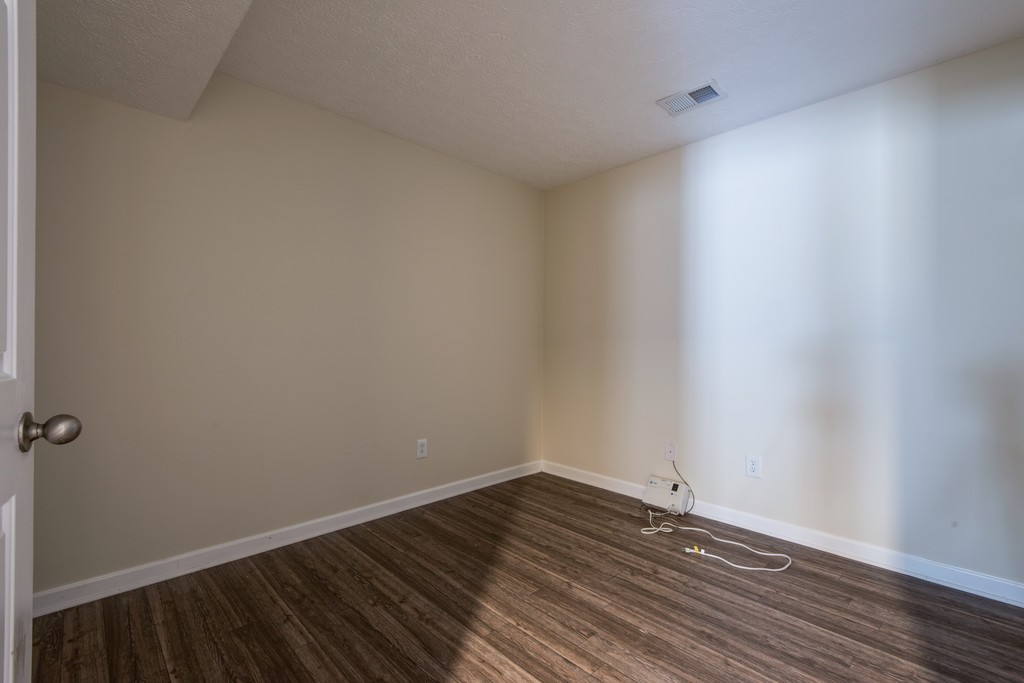7831 Heaton Way Nashville, TN 37211 - Photo 31 of 35 a view of a room with wooden floor and white walls