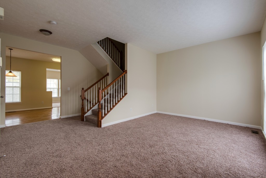 7831 Heaton Way Nashville, TN 37211 - Photo 5 of 35 a view of an empty room with stairs and a view of bedroom
