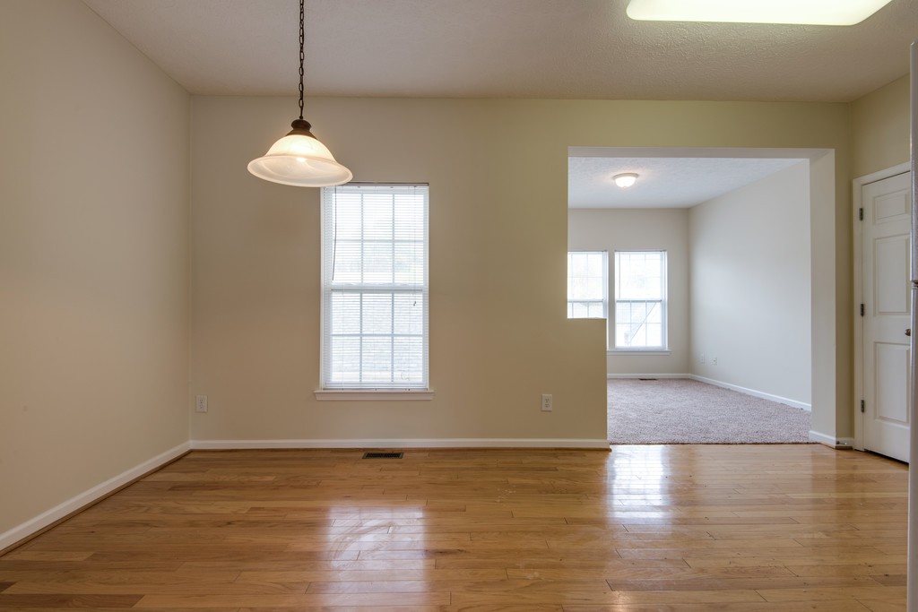 7831 Heaton Way Nashville, TN 37211 - Photo 9 of 35 a view of an empty room with window and wooden floor