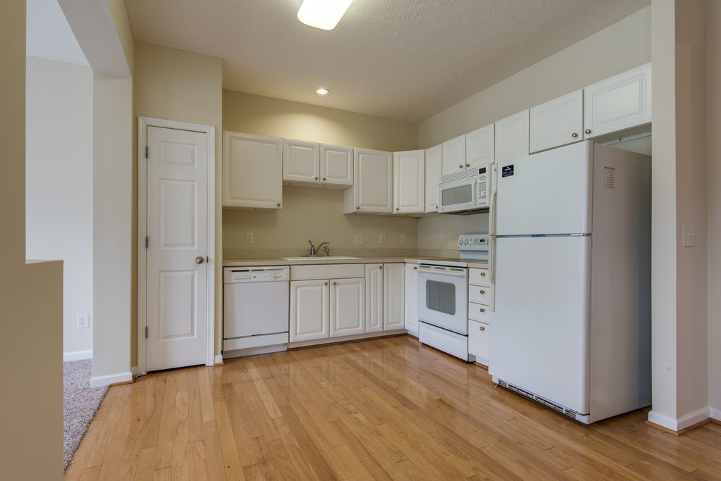 7831 Heaton Way Nashville, TN 37211 - Photo 10 of 35 a kitchen with white cabinets and white appliances