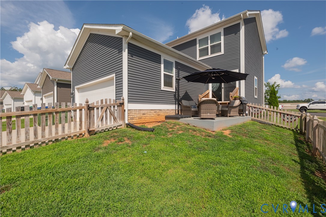 17854 Meriwether Lewis Street Ruther Glen, VA 22546 - Photo 37 of 39 Exterior featuring dark gray siding, white trim, a