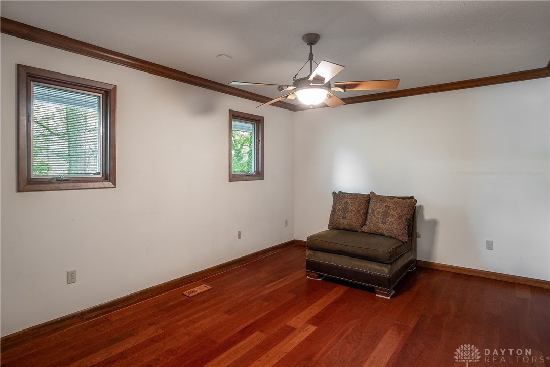 273 North Alpha Bellbrook Road Dayton, OH 45434 - Photo 34 of 43 This bright room features rich hardwood flooring and warm wood trim, creating an inviting atmosphere.