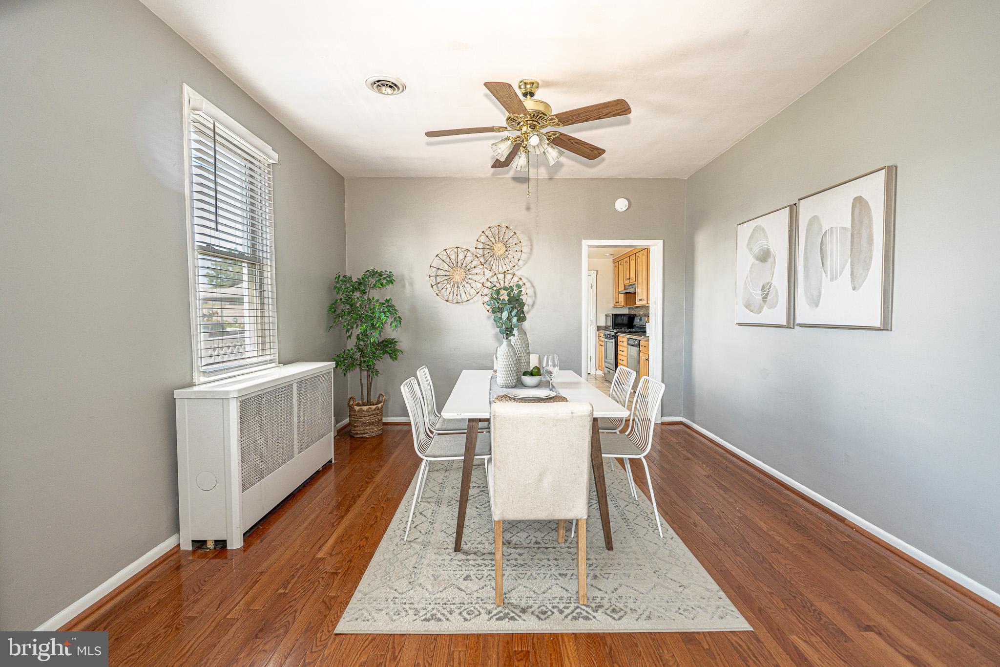 29 Sollers Point Road Baltimore, MD 21222 - Photo 5 of 29 a dining room with wooden floor and a window