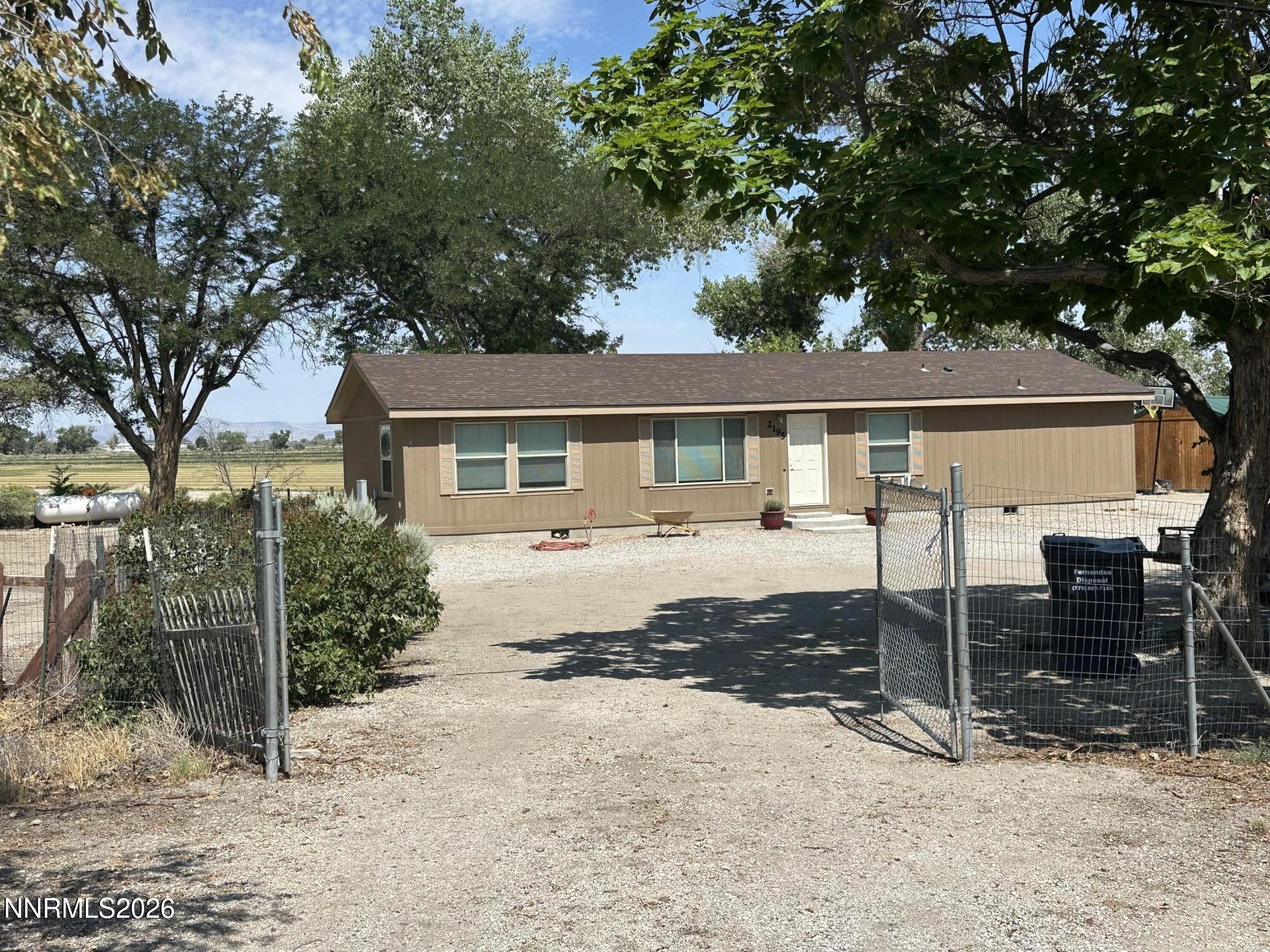 2195 Old River Road Fallon, NV 89406 - Photo 1 of 48 a front view of a house with garden
