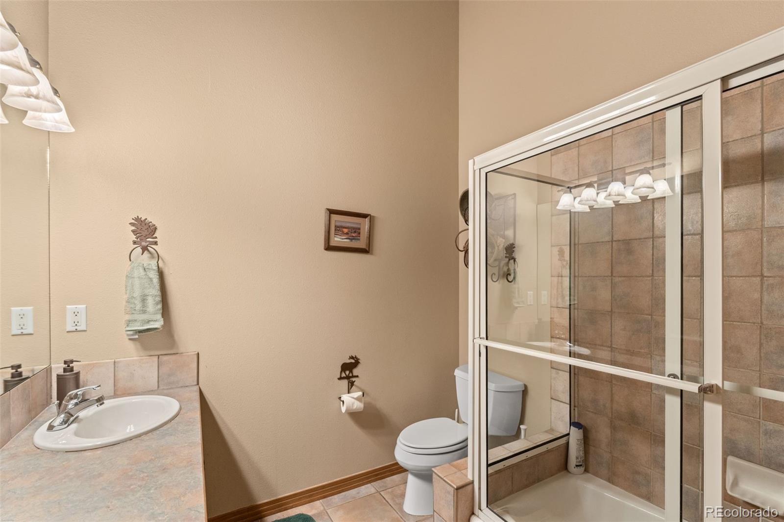 92 Emmett Lode Road, Unit B Breckenridge, CO 80424 - Photo 23 of 50 a bathroom with a sink toilet and shower
