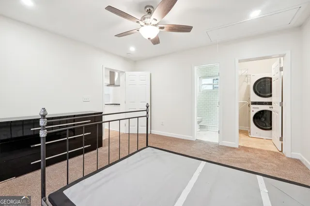 a view of a hallway with washer and dryer