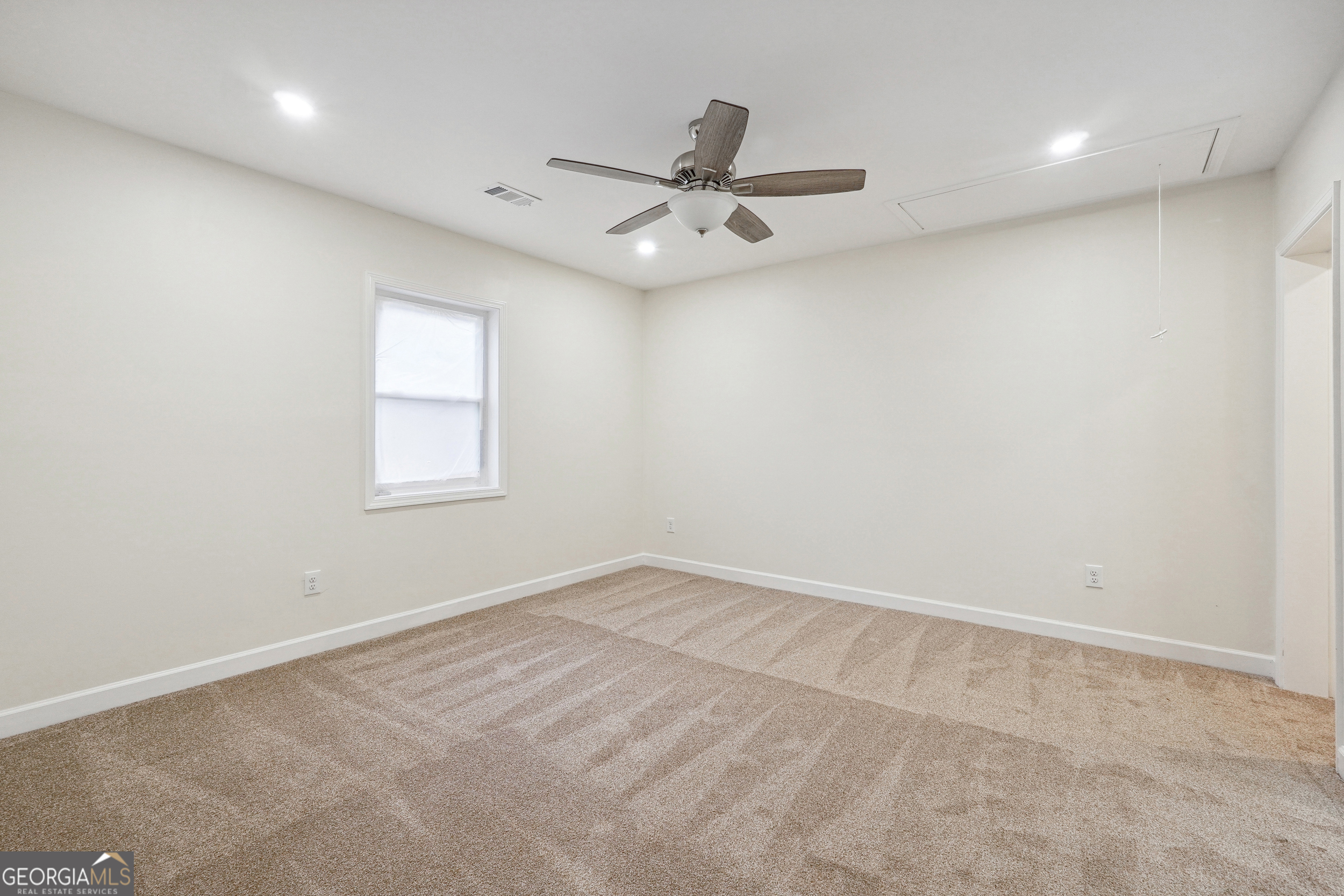 1032 Garibaldi Street Southwest, Unit B Atlanta, GA 30310 - Photo 17 of 30 an empty room with a window and a fan