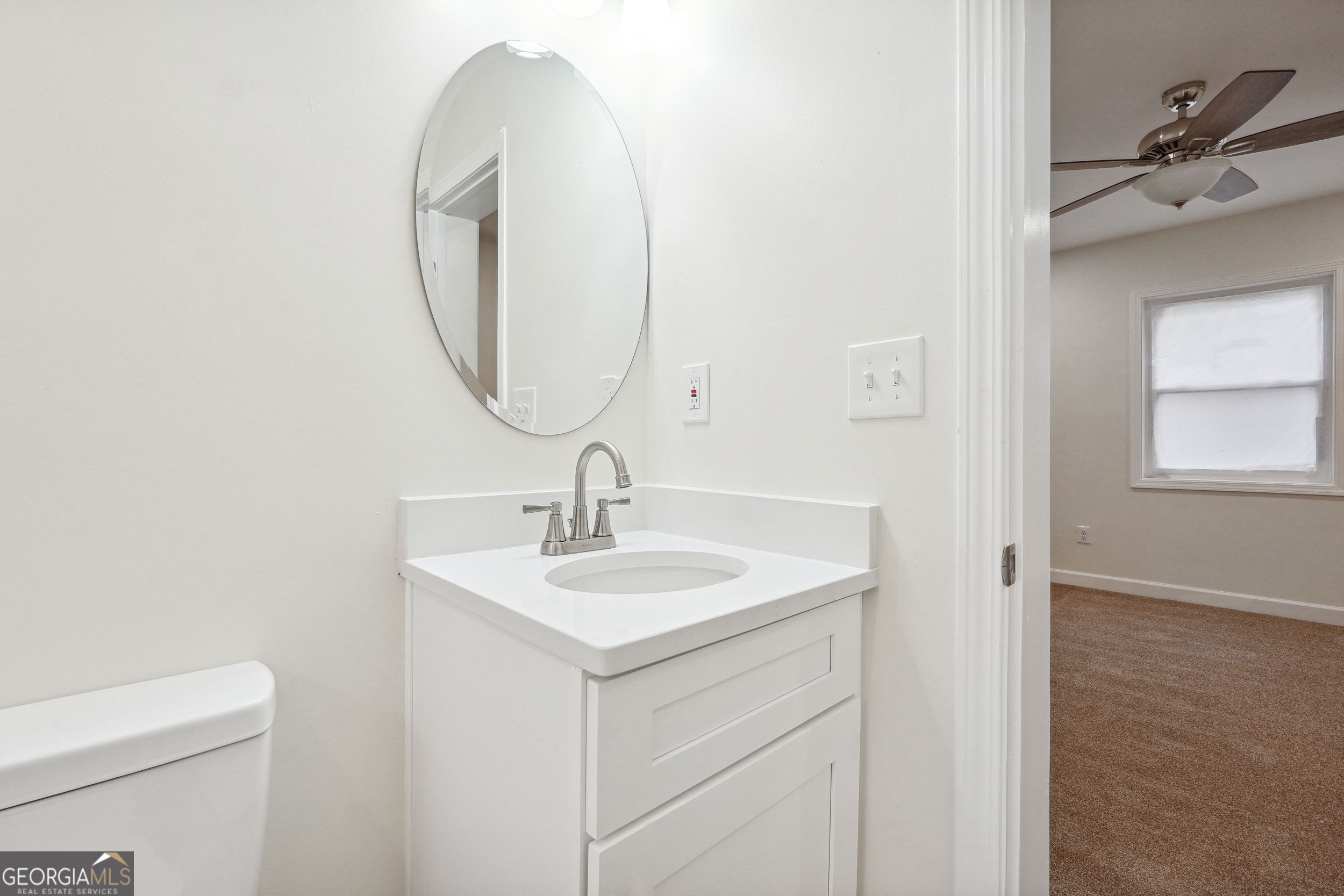 1032 Garibaldi Street Southwest, Unit B Atlanta, GA 30310 - Photo 20 of 30 a bathroom with a toilet sink and mirror