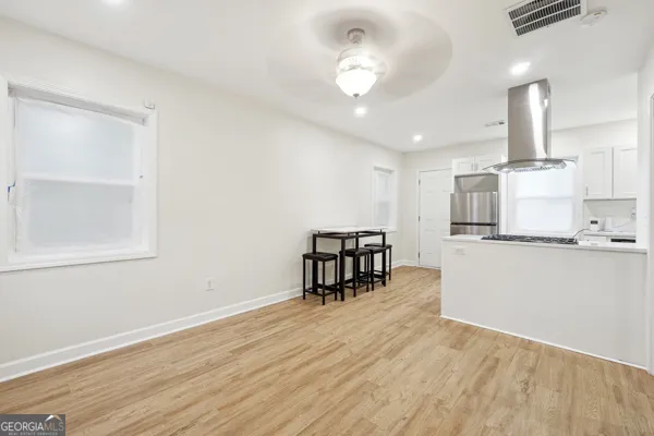 a view of a kitchen with workspace and a window