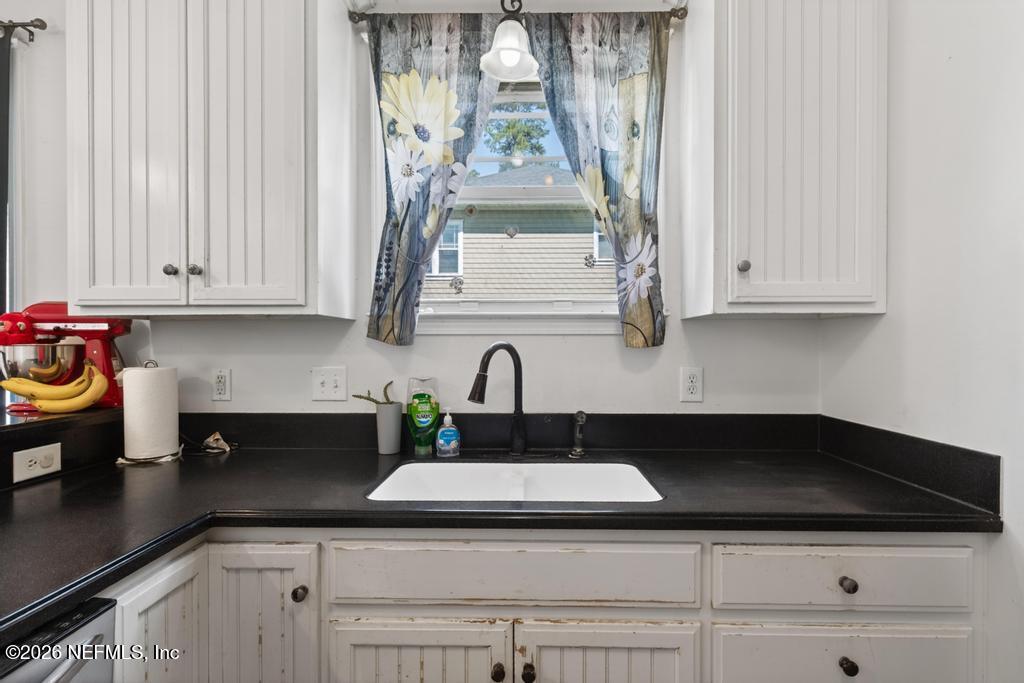 45107 South Booth Street Callahan, FL 32011 - Photo 19 of 68 a kitchen with stainless steel appliances granite countertop white cabinets and a granite counter tops