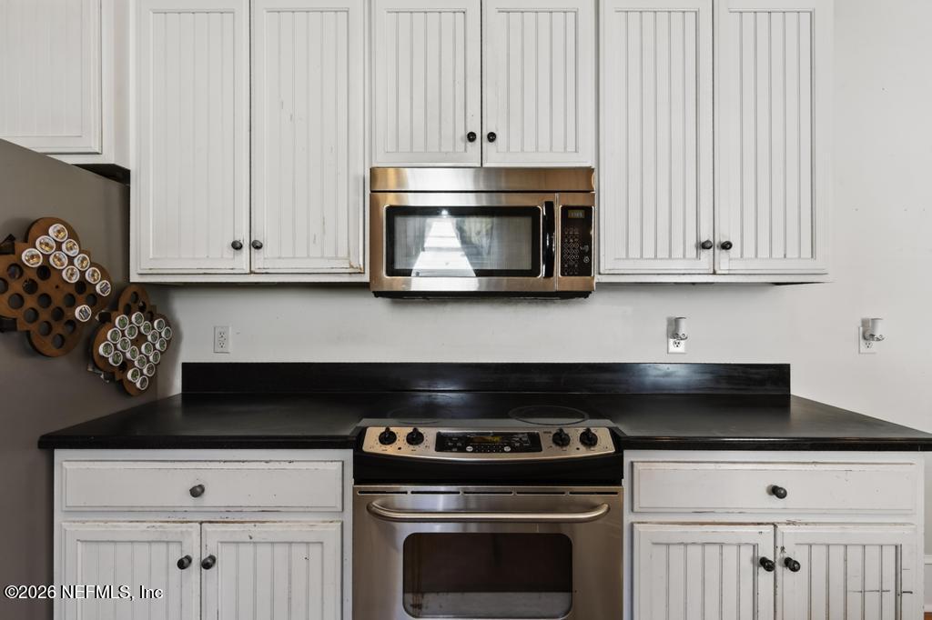 45107 South Booth Street Callahan, FL 32011 - Photo 20 of 68 a stove top oven sitting inside of a kitchen