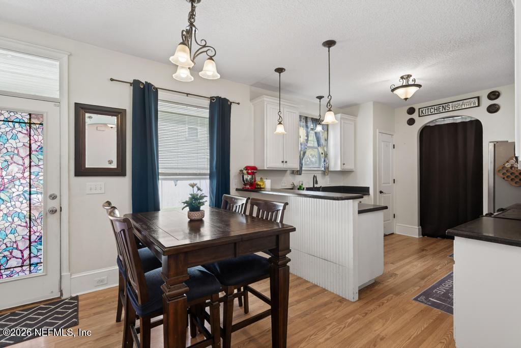 45107 South Booth Street Callahan, FL 32011 - Photo 22 of 68 a kitchen with a dining table and chairs
