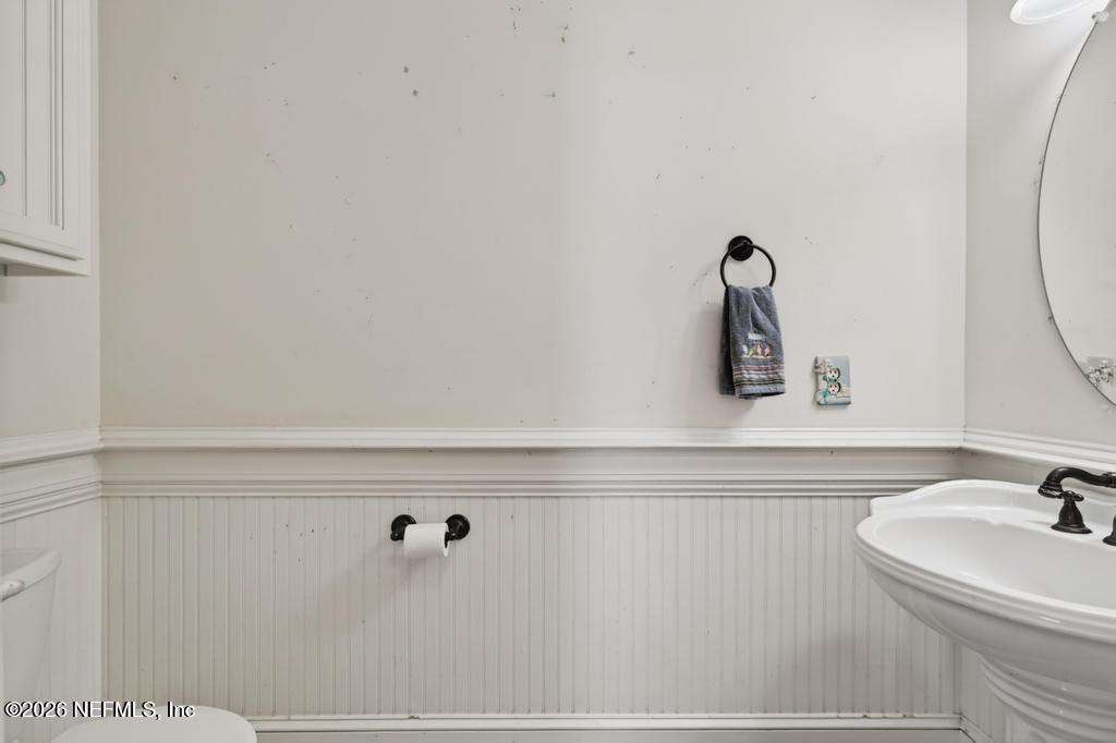 45107 South Booth Street Callahan, FL 32011 - Photo 26 of 68 a bathroom with a sink and mirror