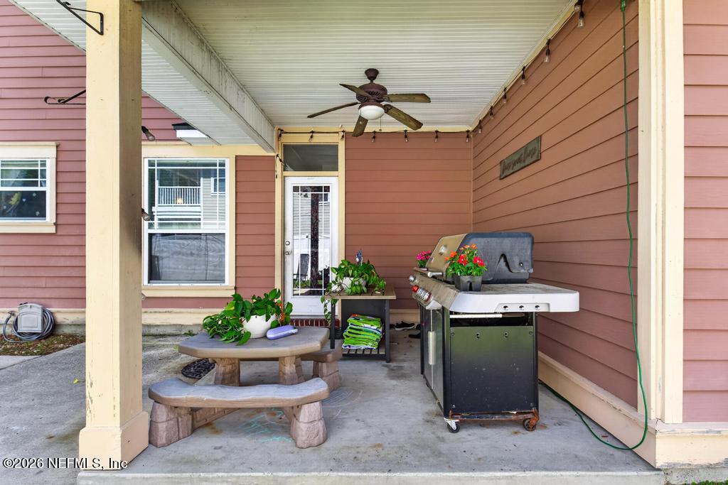 45107 South Booth Street Callahan, FL 32011 - Photo 54 of 68 a table and chairs in front of a house