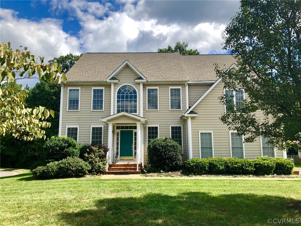 11904 Turning Branch Road Glen Allen, VA 23059 - Photo 1 of 5 a front view of a house with a yard