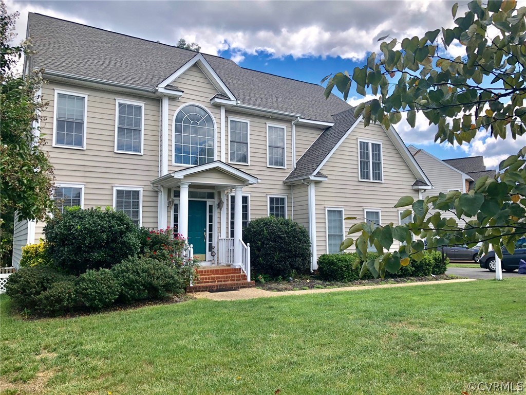 11904 Turning Branch Road Glen Allen, VA 23059 - Photo 2 of 5 a front view of a house with a garden