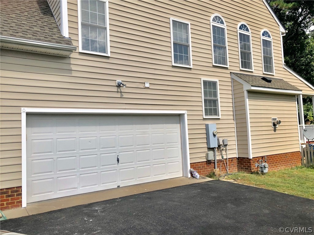 11904 Turning Branch Road Glen Allen, VA 23059 - Photo 5 of 5 a view of a house with a yard and garage