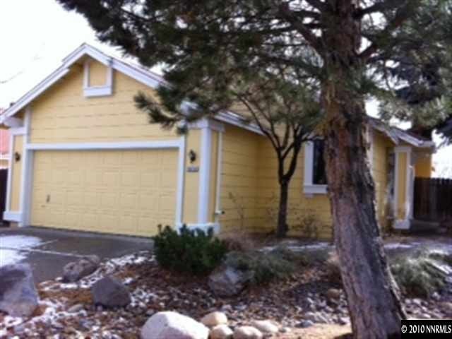 5870 Coyote Ridge Road Reno, NV 89523 - Photo 1 of 6 a front view of a house with garden