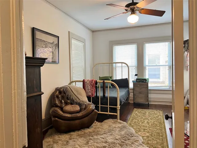 a bedroom with furniture and a window