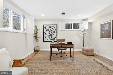 a view of a livingroom with furniture and a window