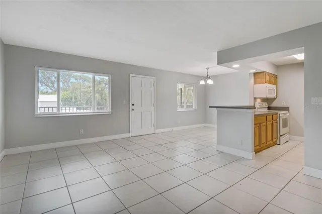 a view of a kitchen with furniture and a window
