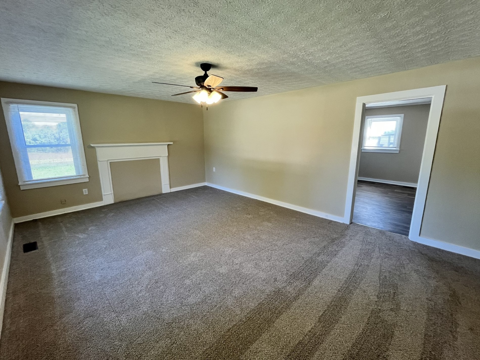 2220 Willette Road Red Boiling Springs, TN 37150 - Photo 11 of 30 an empty room with windows and fan