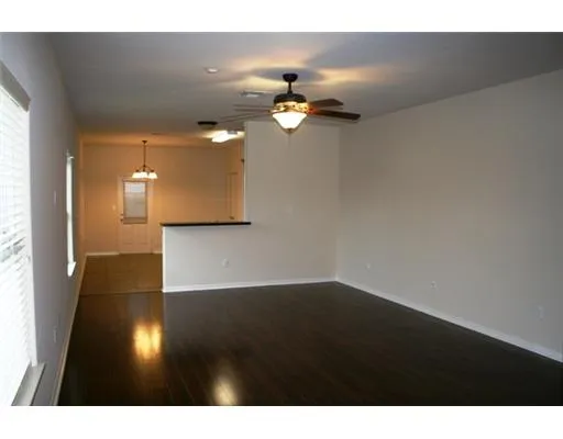 a view of a living room with hardwood floor