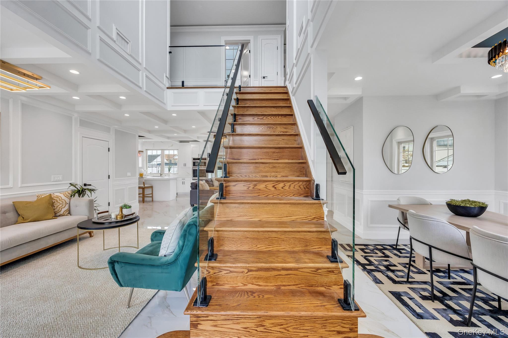 157 4th Street Hicksville, NY 11801 - Photo 3 of 20 Stairway featuring wainscoting, a decorative wall, and recessed lighting