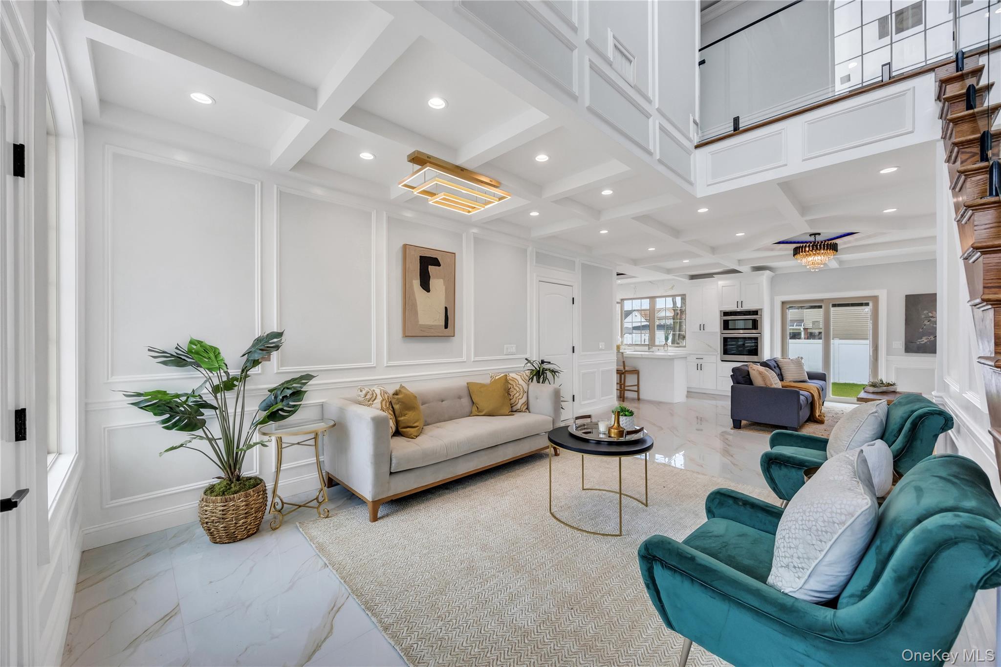 157 4th Street Hicksville, NY 11801 - Photo 4 of 20 Living room featuring beam ceiling, recessed lighting, coffered ceiling, marble finish floor, and a decorative wall