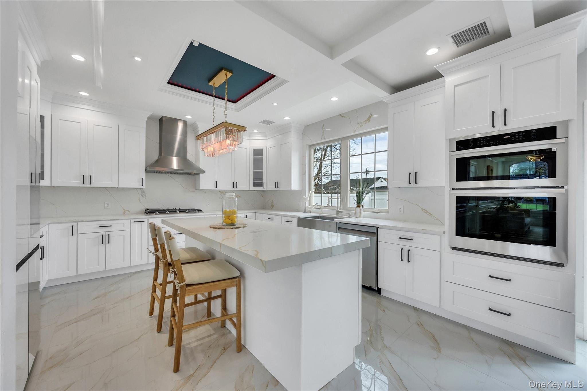 157 4th Street Hicksville, NY 11801 - Photo 7 of 20 Kitchen with wall chimney exhaust hood, marble finish floor, stainless steel appliances, and visible vents