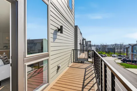 a balcony with view of residential house