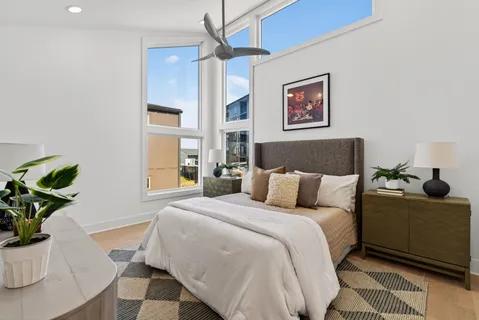 a bedroom with a bed and a couch