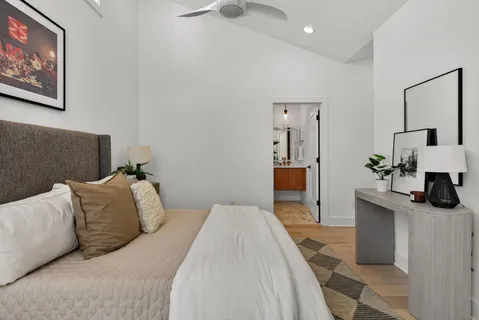 a bedroom with a bed and a couch