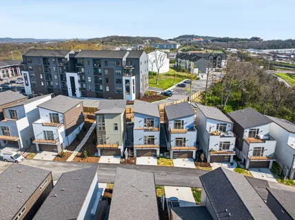 an aerial view of residential houses and street