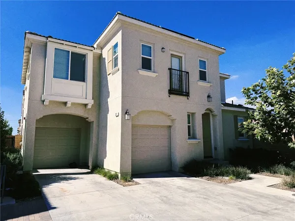 a front view of a house with garage