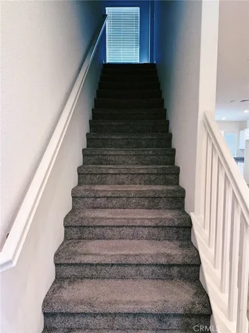 a bathroom with a window and a shower