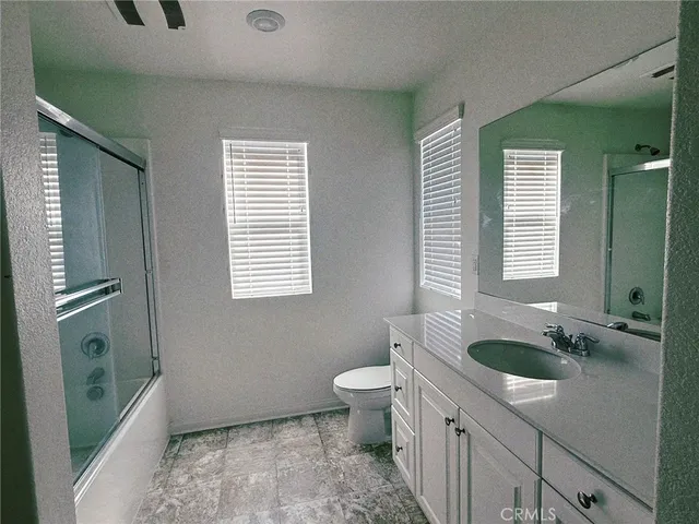 a view of an empty room with a bathroom