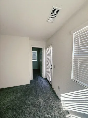 a bathroom with a shower and a glass door