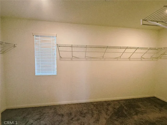 a view of storage and utility room with stairs